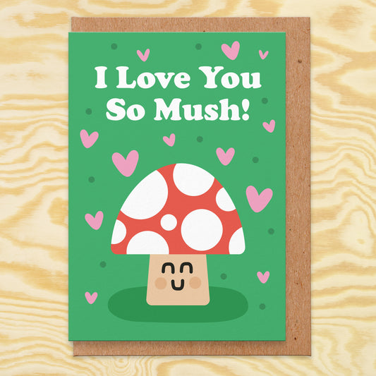 Love card with an illustration of a mushroom on a green background with pink hearts all over and it reads I love you so mush!