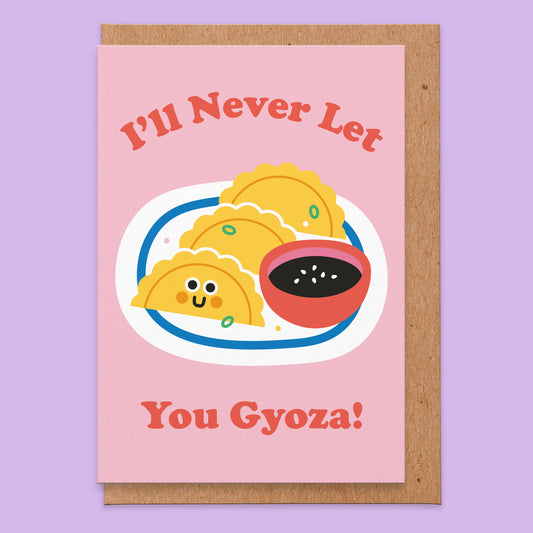 Love card with an illustration go 3 gyozas on a plate with some dipping sauce and the words read I'll never let you gyoza!