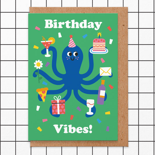 Birthday card that reads birthday vibes. There is an illustration of an octopus that is holding birthday cake, an envelope, a bottle of wine and a glass, a present, slice of pizza, a flower and a cocktail.
