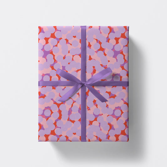 a square present wrapped in cherry blossom pattern wrapping paper by studio boketto