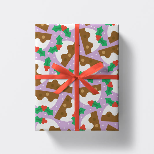 christmas present wrapped in christmas pudding pattern wrapping paper by studio boketto