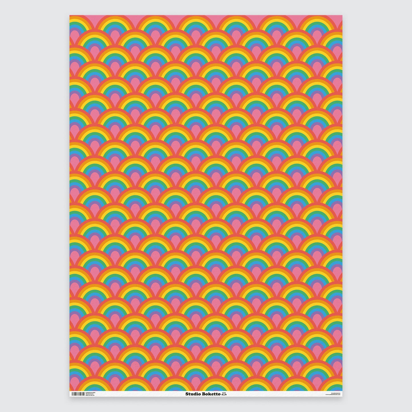 flat sheet of wrapping paper with rainbow design and pattern