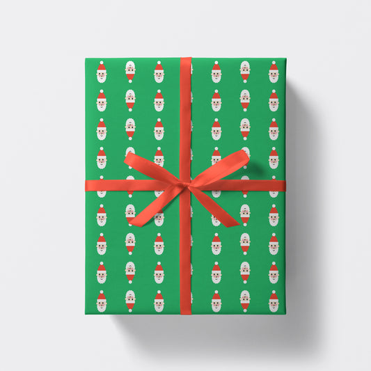hristmas present wrapped in santa pattern wrapping paper by studio boketto