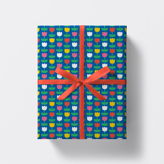 a square present wrapped in tulips pattern wrapping paper by studio boketto
