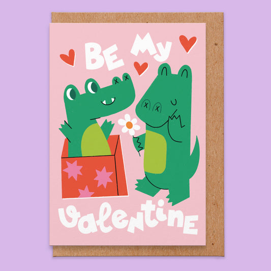 Valentine's card with an illustration of two crocodiles and the words read be my valentine.