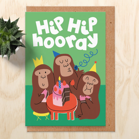 Birthday card with three monkeys eating cake and having a party. The text reads hip hip hooray