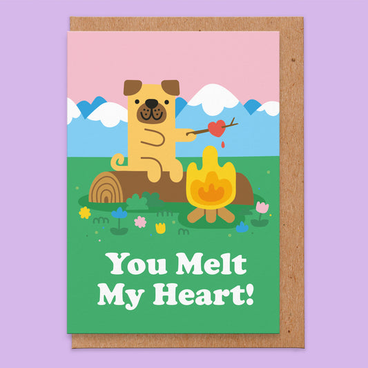 Love card that reads you melt my heart with an illustration of a pug sat by a campfire toasting a love heart shaped marshmallow.