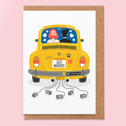 Wedding card with a yellow retro car illustration with a view from the back and the registration plate says just married. There is a bride and groom in the front driving.