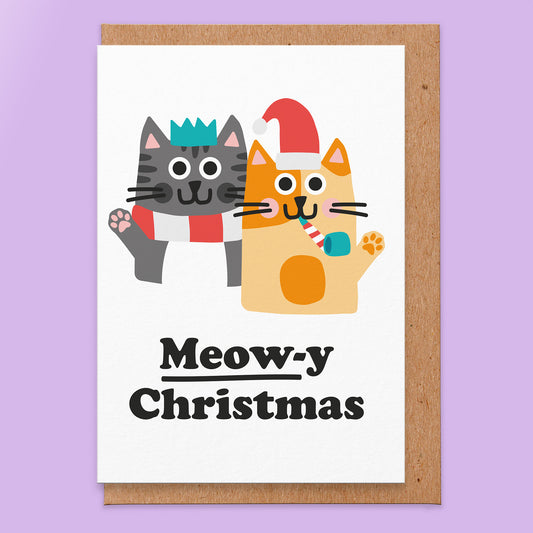 Christmas card that reads meowy christmas with an illustration of two cats.
