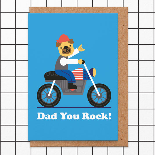 Father's Day card with an illustration of a pug wearing a red bandana on a motorbike with a American flag on the petrol tank and reads Dad You Rock!