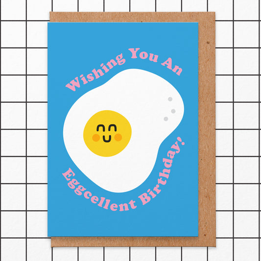 Birthday card with an illustration of a smiling egg on a bright blue background. It reads wishing you an eggcellent birthday!