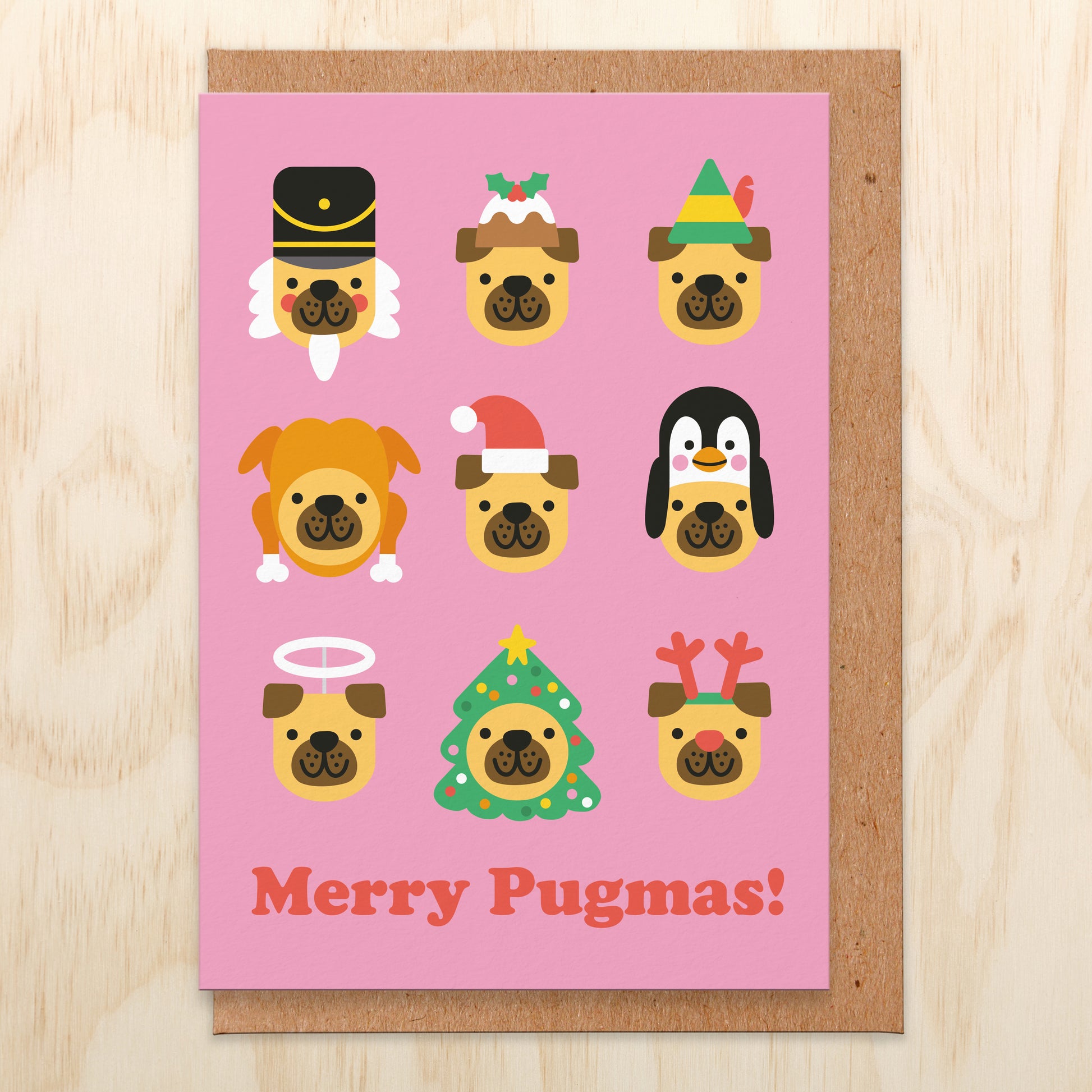 Christmas greetings card with an illustration of 9 pug dogs in different Christmas hats and says Merry Pugmas!