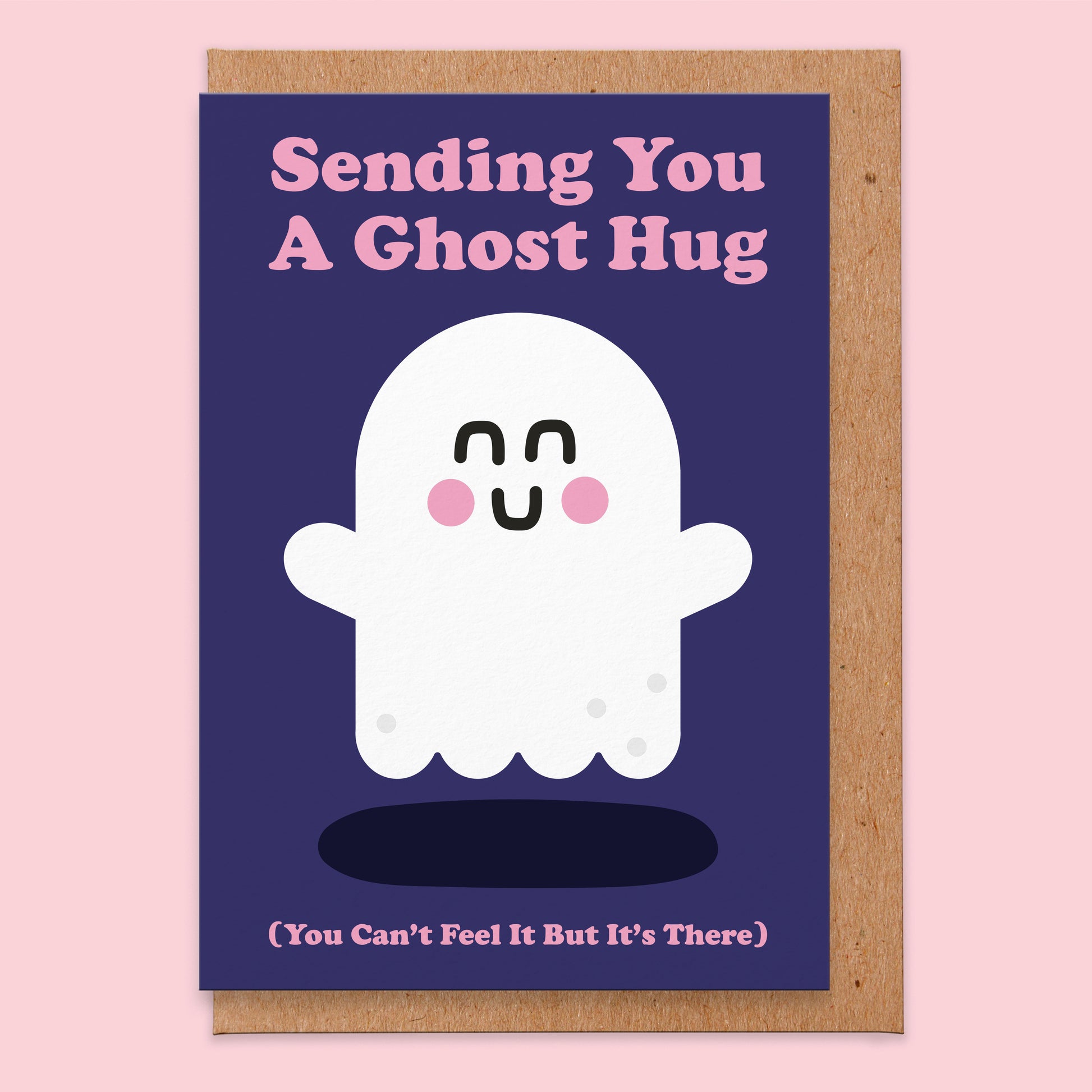 Greetings card with a navy background and an illustration of a ghost on that reads Sending You A Post Hug You Can't Feel It But It's There
