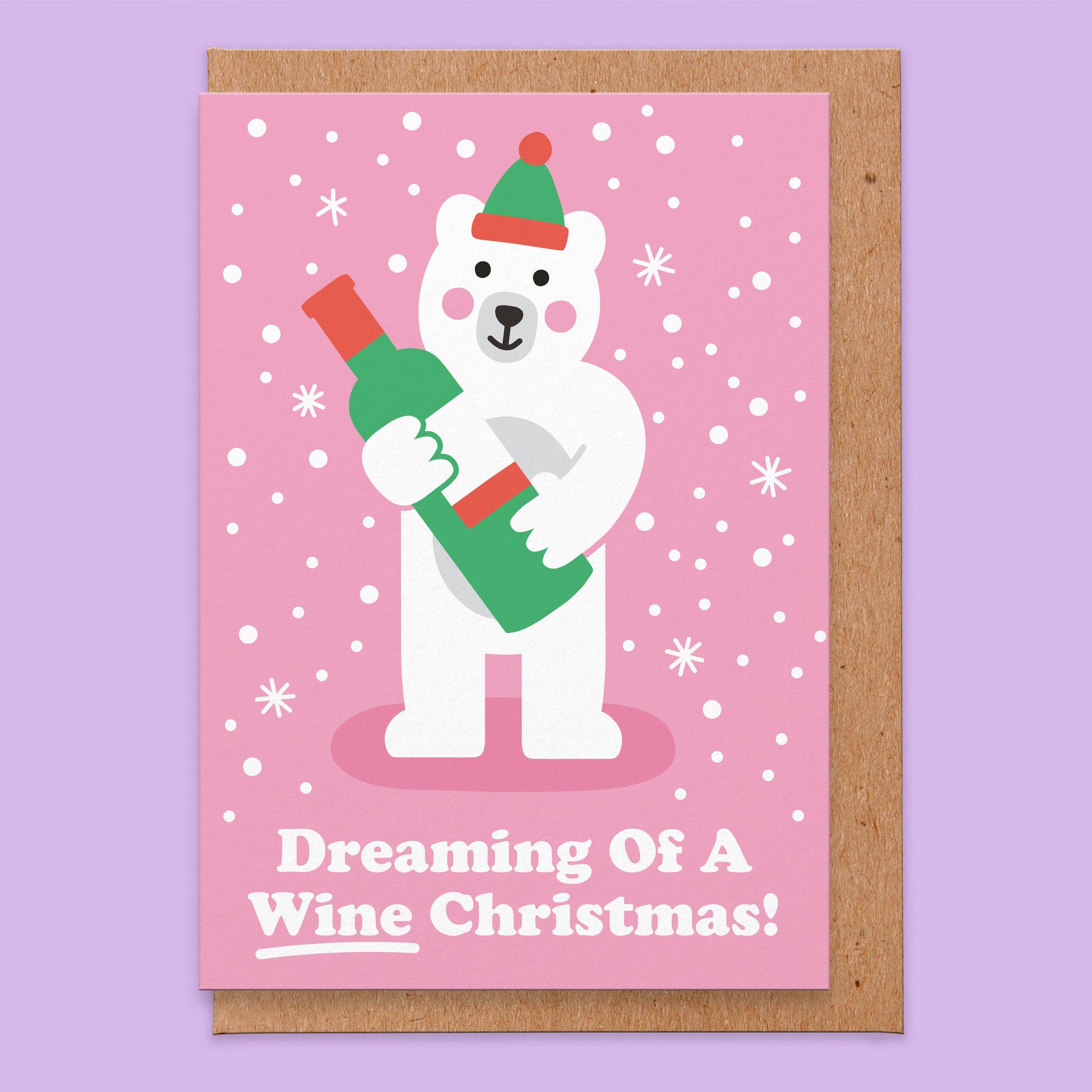 Christmas greetings card with an illustration of a white bear holding a bottle of wine and says Dreaming Of A Wine Christmas!