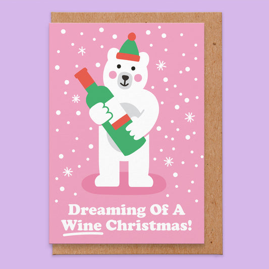 Christmas greetings card with an illustration of a white bear holding a bottle of wine and says Dreaming Of A Wine Christmas!