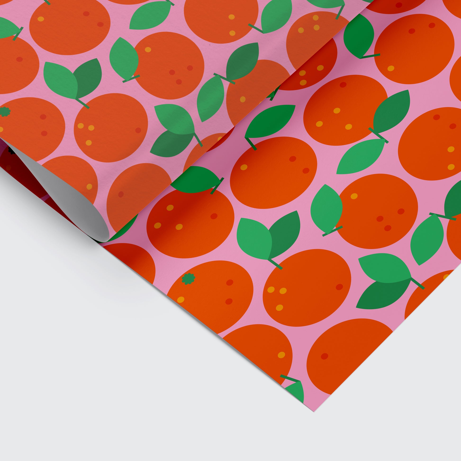 Christmas wrapping paper with clementine pattern on it