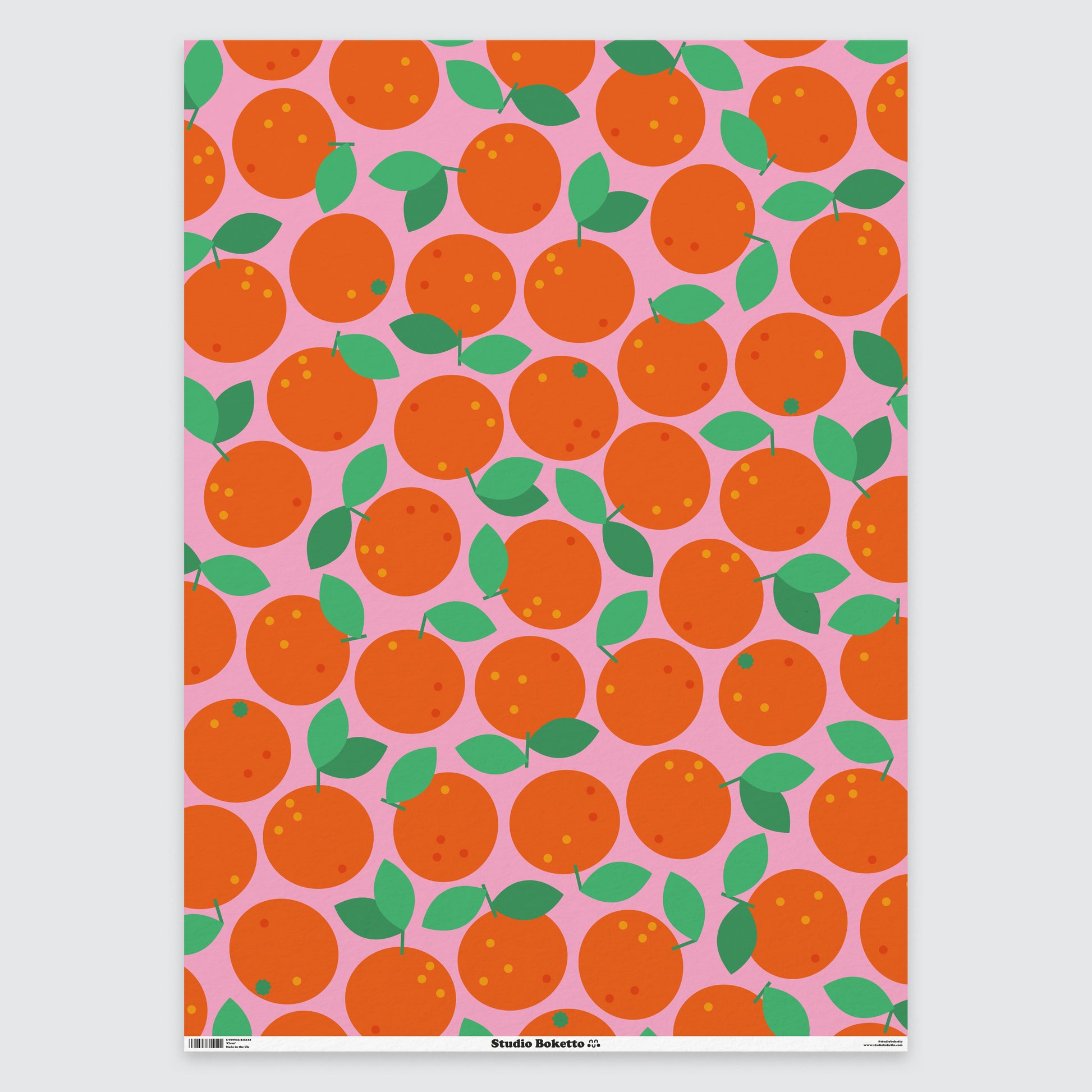 flat sheet of christmas wrapping paper with clementine design and pattern