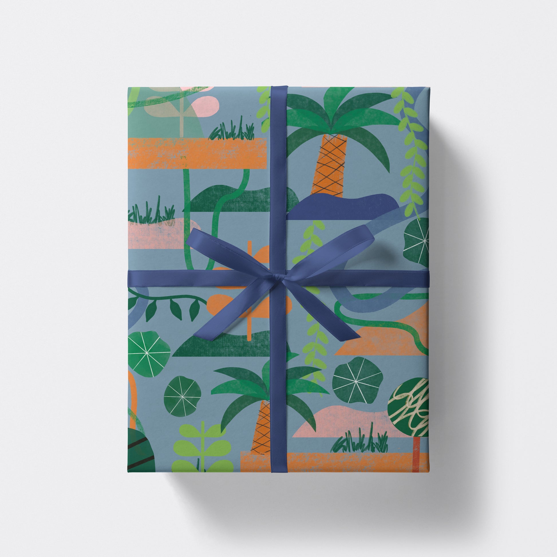 a square present wrapped in jungle pattern wrapping paper by studio boketto