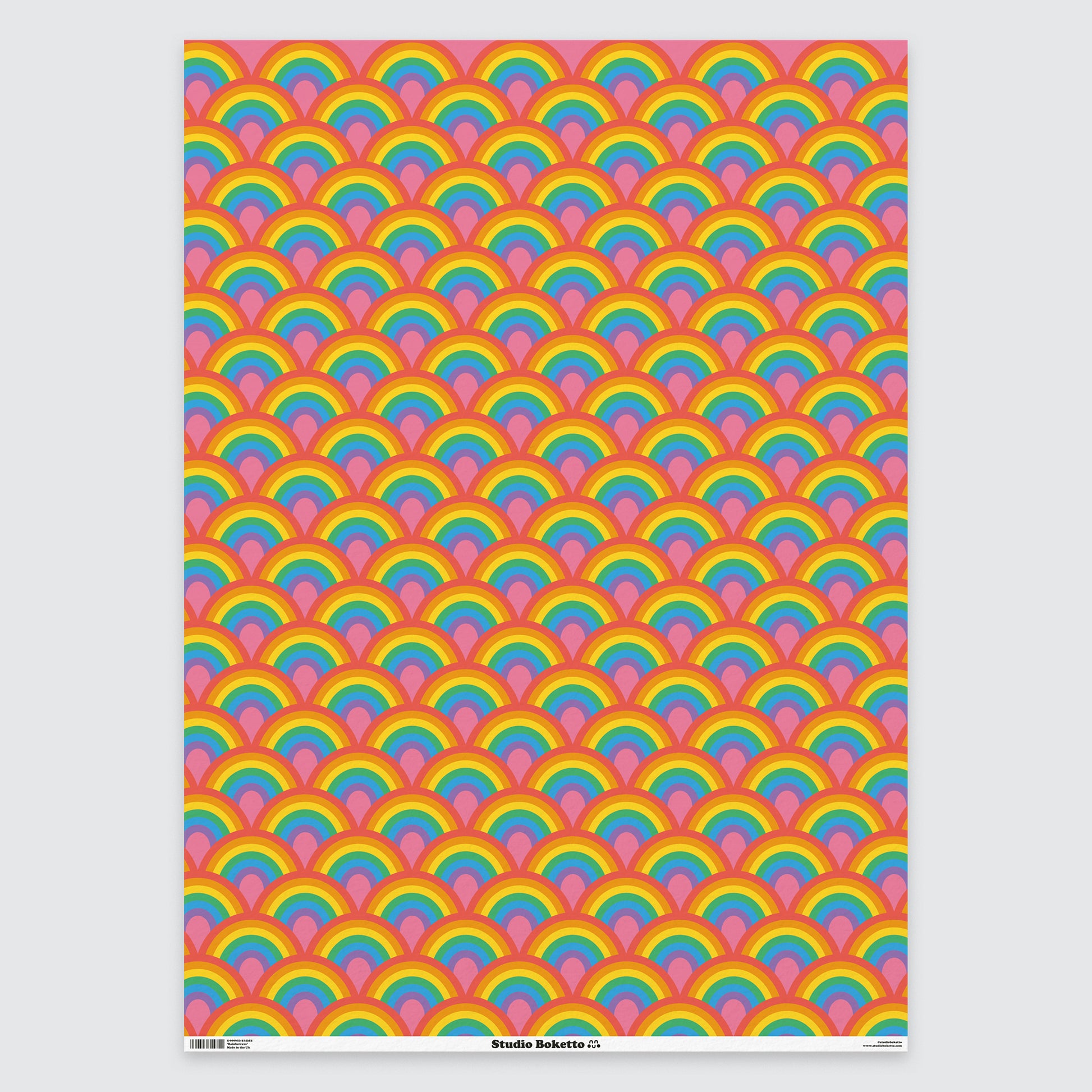 flat sheet of wrapping paper with rainbow design and pattern