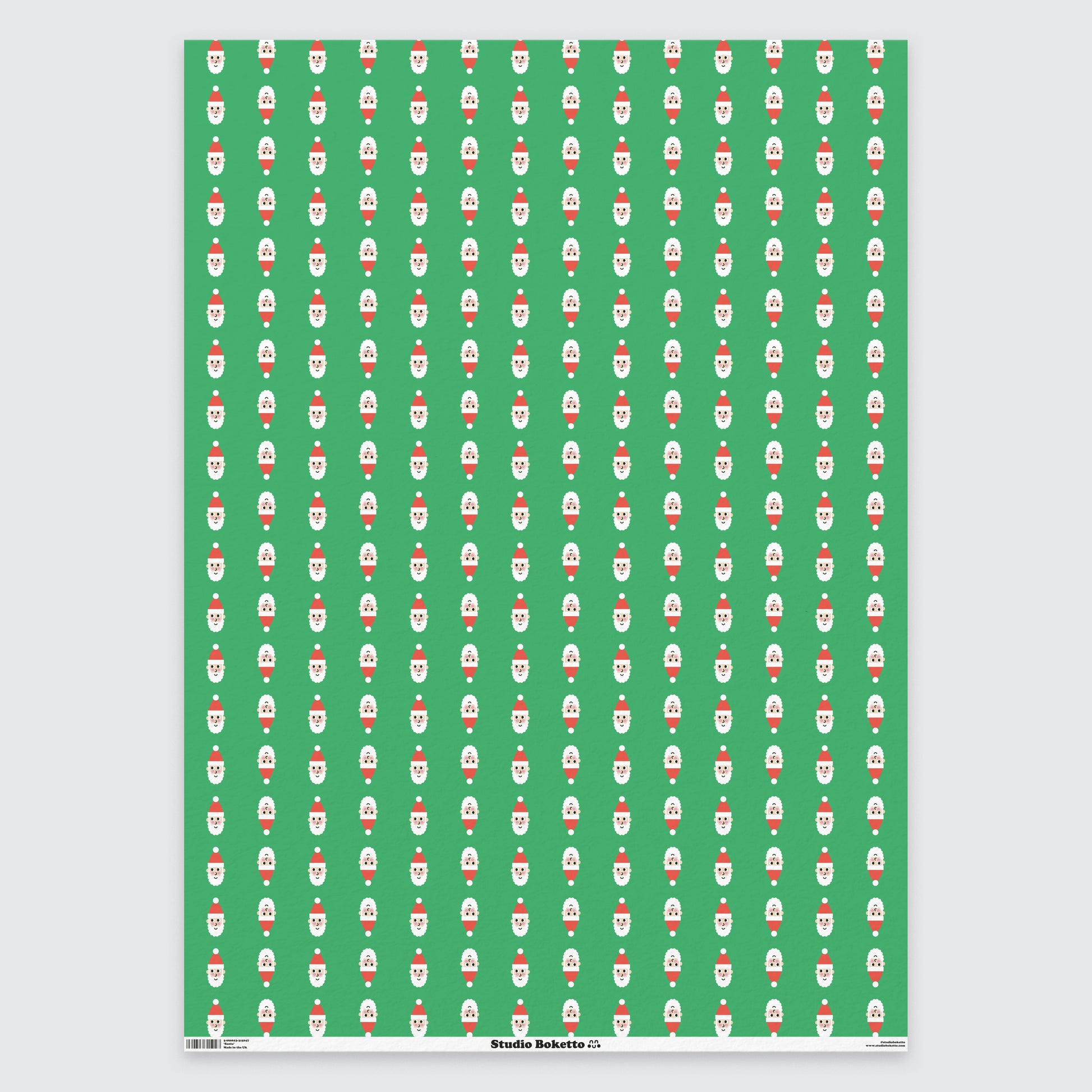 flat sheet of christmas wrapping paper with santa design and pattern