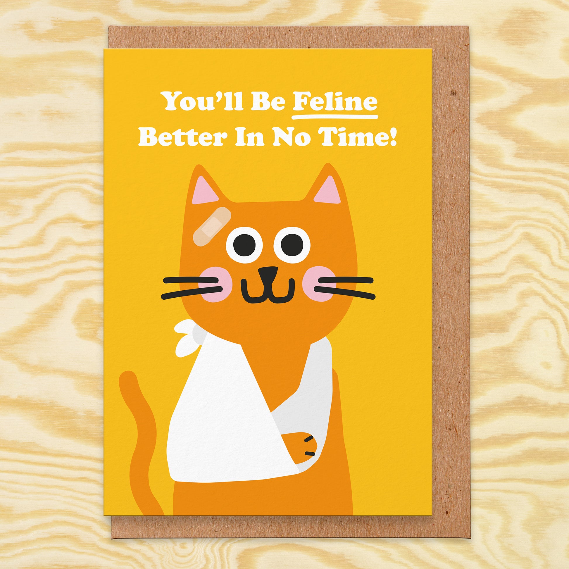 Get Well Soon card that reads You'll Be Feline Better In No Time! With a picture of a ginger cat wearing a sling on its arm and a plaster on it's head.