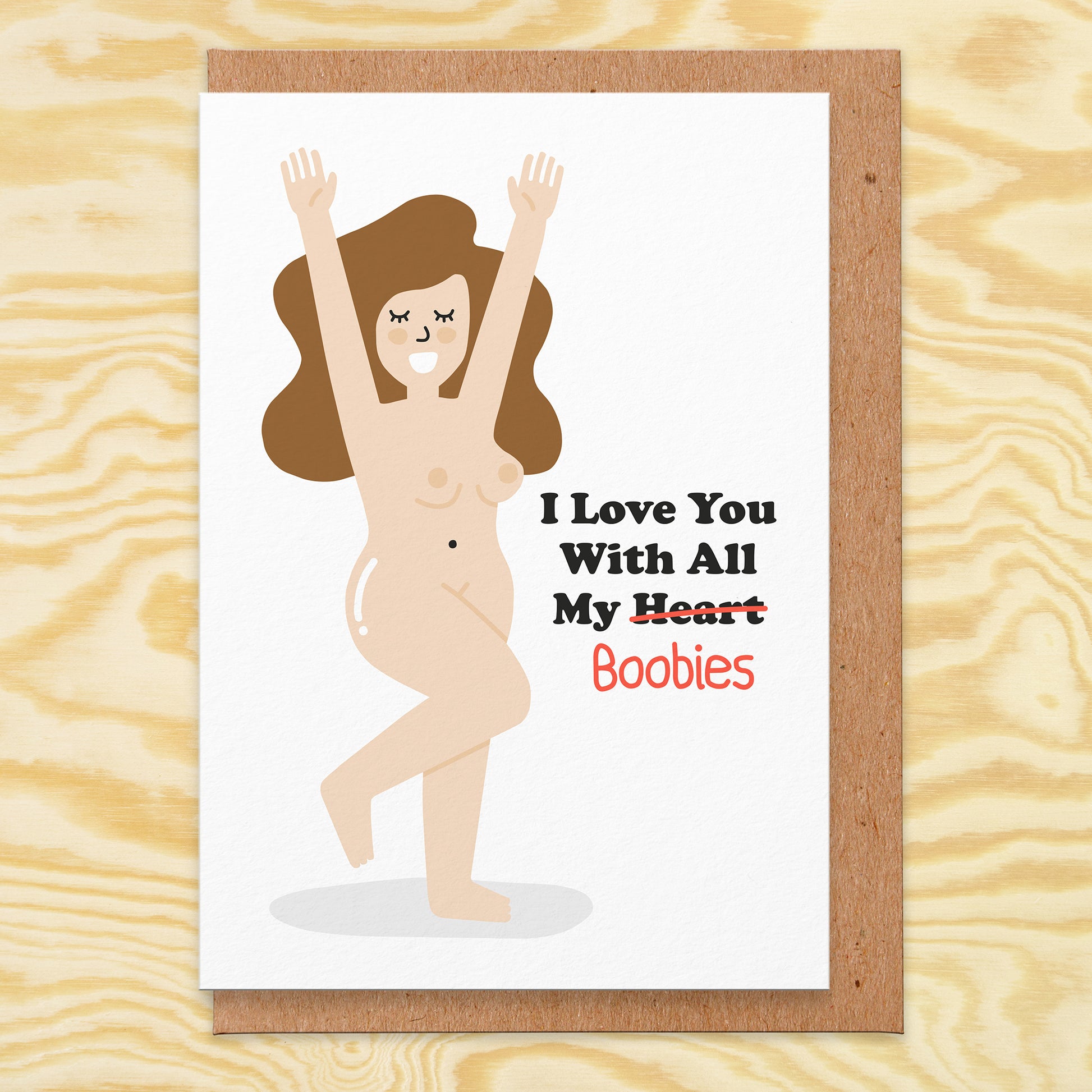 Love card that has an illustration of a naked lady and it reads I love you with all my heart but the heart is crossed out and it says boobies.