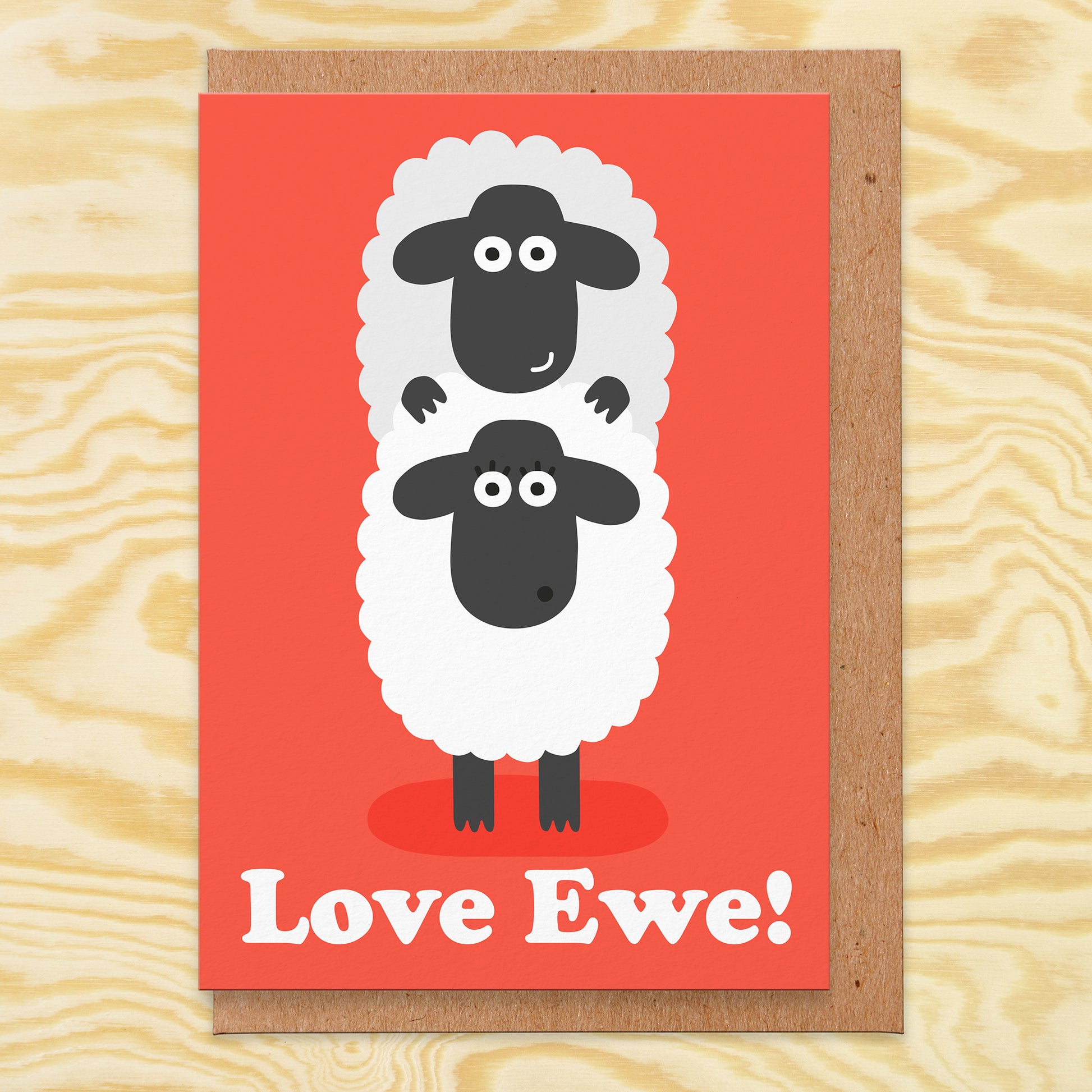 Love card with an illustration of two sheep on a red background and it reads love ewe!