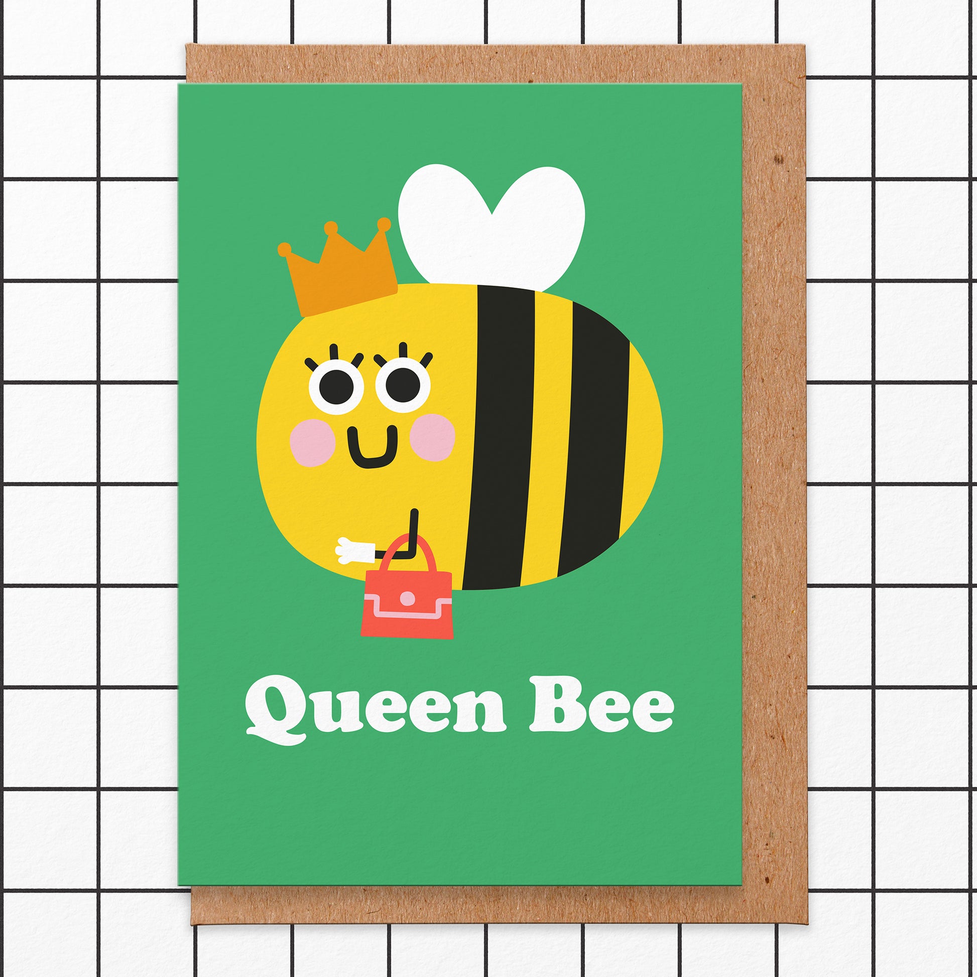 Greetings card that has an illustration of a smiling Bee with a crown  & handbag and says Queen Bee
