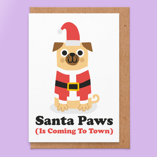 Christmas card with an illustration of a pug dressed as Santa and it reads Santa paws (is coming to town).