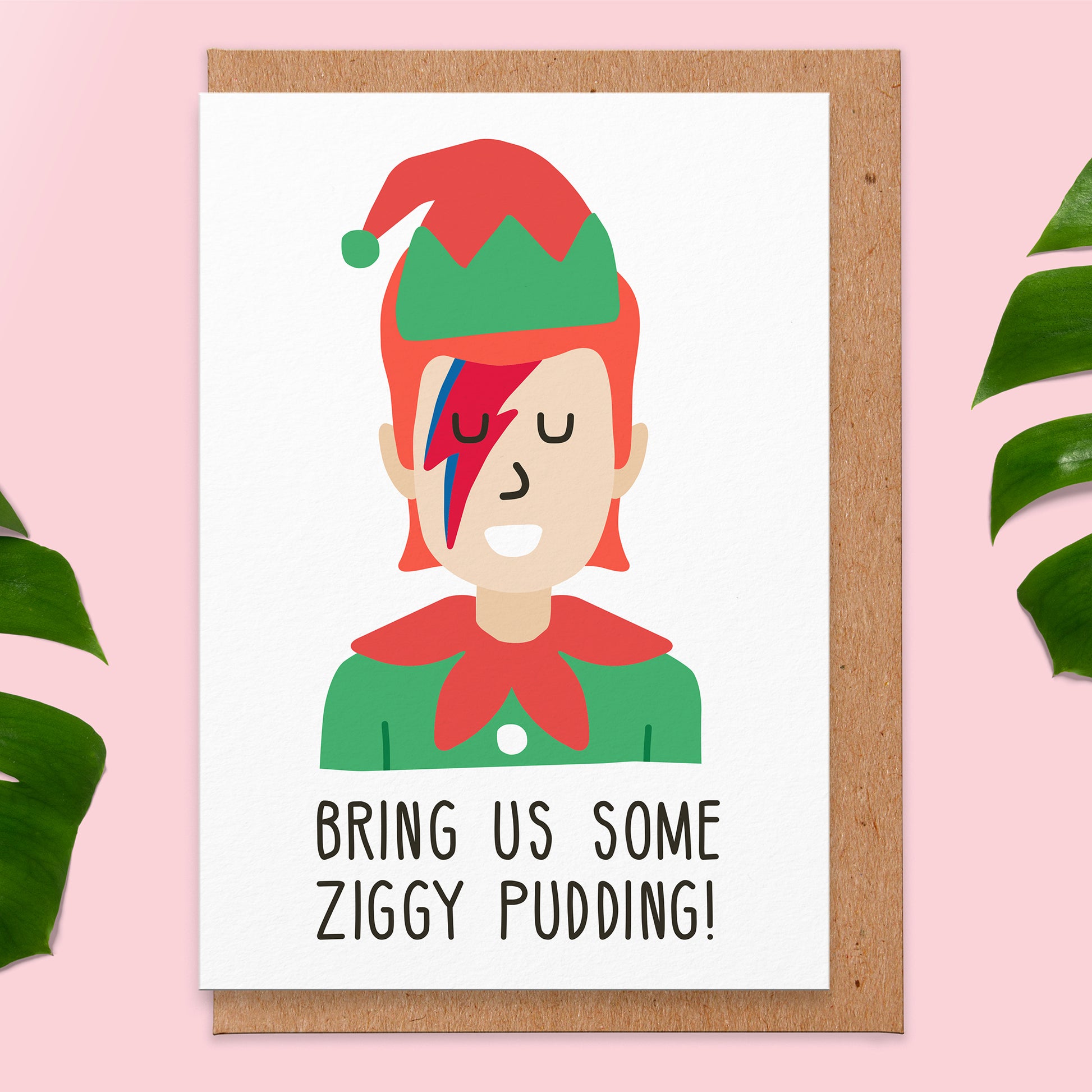 Christmas card with an illustration of the starman singer dressed up as an elf and the text reads bring us some ziggy pudding!